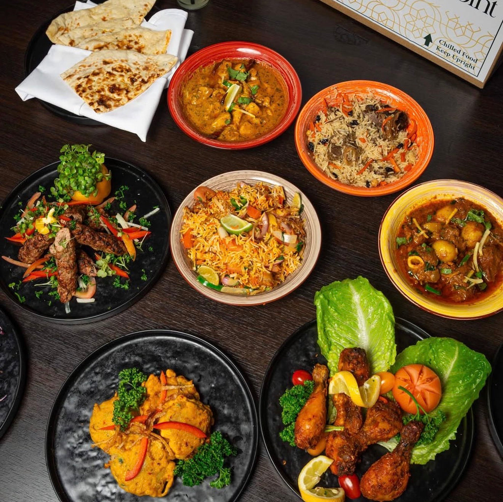 numerous curry dishes from a takeaway home box from Midpoint Aagrah in bradford