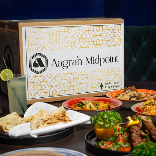 Aagrah Midpoint food box with various dishes on a table